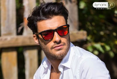 Custom logo sunglasses worn outdoors after a festival as top promotional items in Canada.