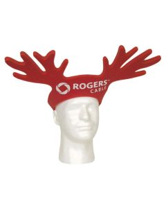 An angled view of a dark red foam reindeer antlers pullover hat with a white logo on the front. The hat is being worn by a mannequin head