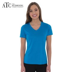 A blue wake heather coloured V-neck ladies tee being worn by a woman with long brown hair and her arms are at her sides