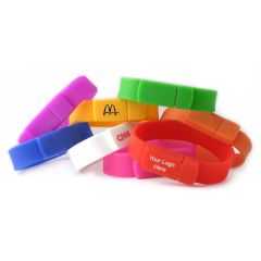 Eight custom printed silicone USB wristbands. Each one is a different shade and the front three have printed logos.