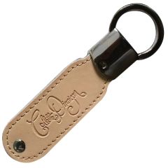 A custom branded brown leather USB with a black attachment ring. There is a logo debossed on the leather.