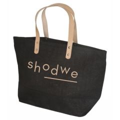 A customized Hamptons tote bag made from jute. The bag is black with brown handles and a brown printed logo.