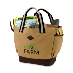 A Heritage Supply garden tote with a green and brown logo. The customized garden tote is light brown with dark trim.