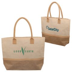 Two laminated totes made from canvas and jute. The front custom branded tote has green print. The other bag has blue print.