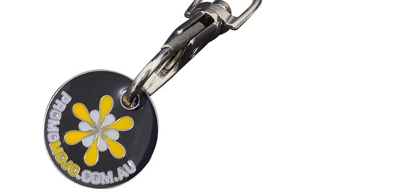 quarter shaped shopping cart token with black, yellow and white hard enamel fill and a trigger clip with split ring