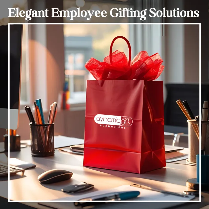 Custom Gift Bag for Employee Gifts A red promotional gift bag with Dynamic Gift Canada printed on it sitting on a desktop in Ontario.