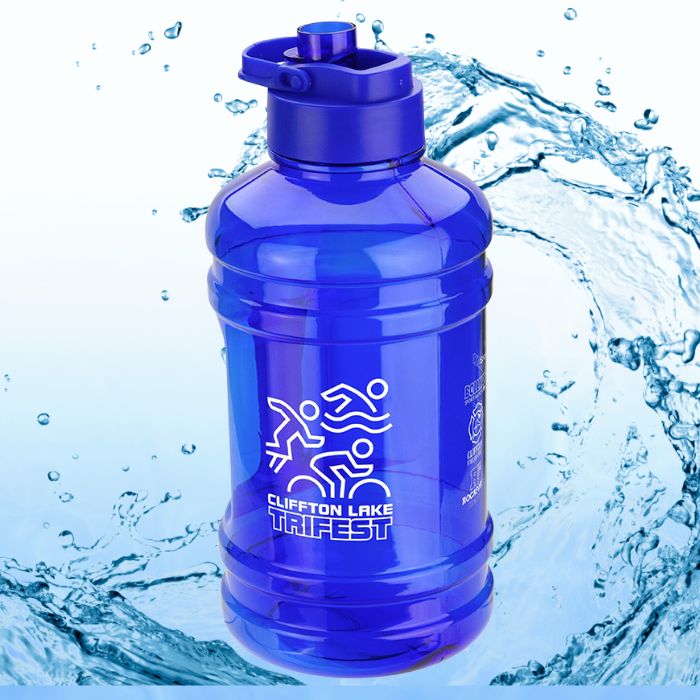 A blue 75oz water jug bottle with white print. The bottle is in front of a breaking water wave and a light blue background.