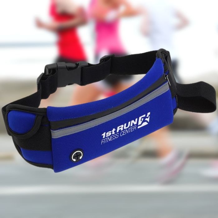 An angled view of a blue running belt with white print. The bag is in front of a blurred background showing people jogging.