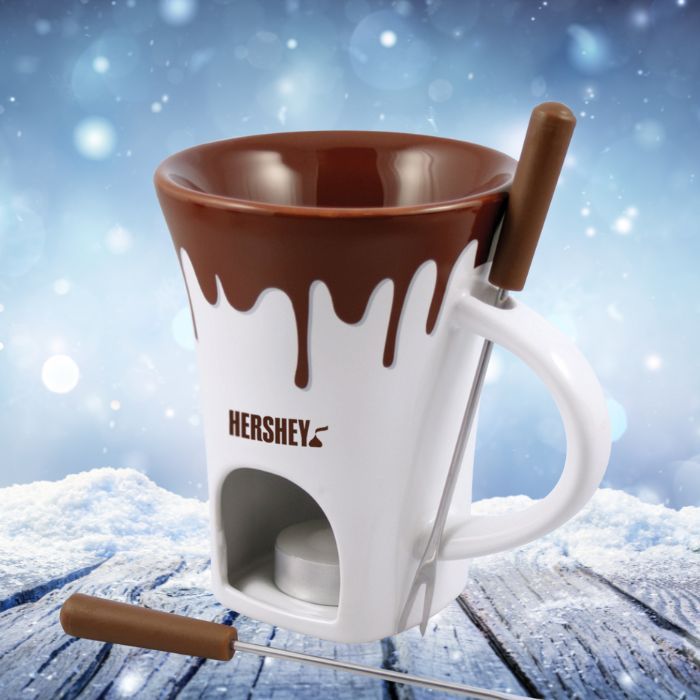 Swissmar Nostalgia Chocolate Fondue Mug Set on a winter background