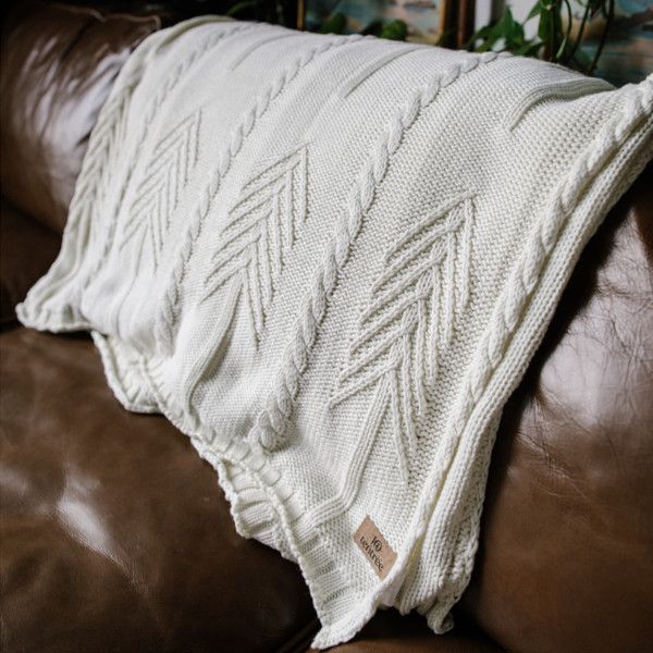 tentree Organic Cotton Cable Blanket on a couch