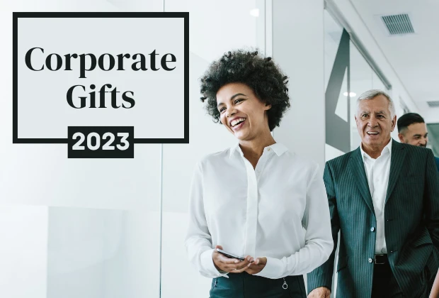 Corporate Gifts 2023 - Happy employees walking down an office hallway